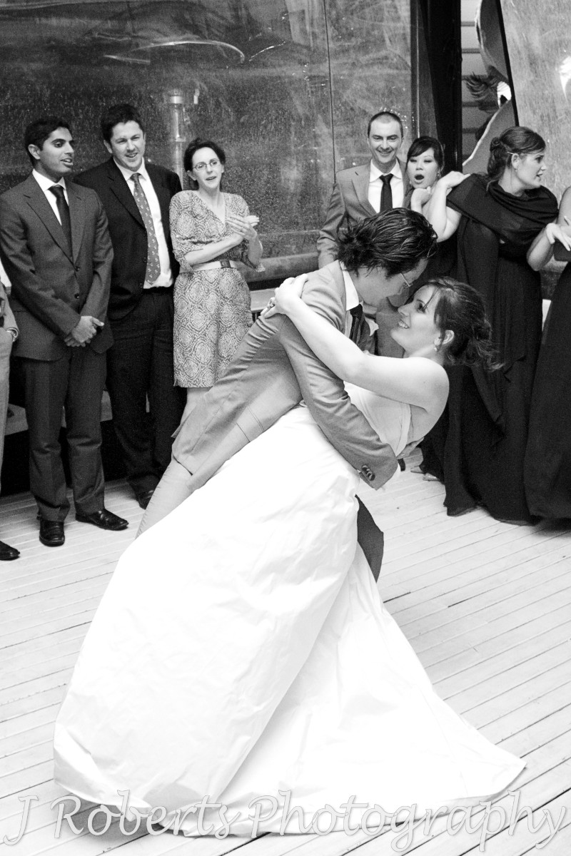Groom dipping bride during bridal waltz - wedding photography sydney